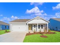 Charming single-story home featuring a two-car garage and landscaped front yard with blue sky at 3046 Deerberry Place, Longs, SC 29568