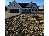 Charming new construction home featuring a spacious garage and traditional architectural details at 3432 Asbury Rd., Aynor, SC 29511