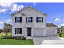 Charming two-story home featuring white siding, black shutters, and a two-car garage at 64 Cape Point Dr., Conway, SC 29527
