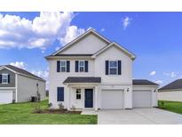 Charming two-story home with a manicured lawn, two-car garage, and classic white siding at 65 Cape Point Dr., Conway, SC 29527