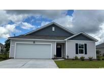 Charming single-story home featuring a two-car garage and neatly landscaped front yard at 358 Jeff Waters Circle, Longs, SC 29568