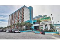 Large, beachfront resort featuring a pool, palm trees, and on-site parking at 1501 S Ocean Blvd. # 240, Myrtle Beach, SC 29577