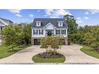 Two-story house with gray siding, a two-car garage, and a landscaped front yard at 130 Hagar Brown Rd., Murrells Inlet, SC 29576