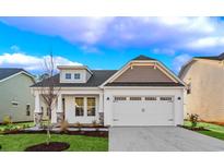 Charming single-Gathering home with a two-car garage, landscaped lawn, and classic white siding at 5028 Cambria Ct., Little River, SC 29566