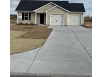 Newly constructed home with 2-car garage and landscaped yard at 815 Busy Corner Rd., Conway, SC 29527