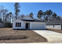 Charming one-story home featuring white siding, black shutters, and a well-manicured lawn at 1126 Cherrystone Loop, Conway, SC 29526