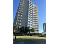 Oceanfront high rise building with balconies and lush landscaping at 9820 S Queensway Blvd. # 607, Myrtle Beach, SC 29572