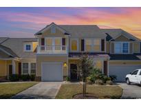 Charming yellow two-story home with beautiful landscaping and a private balcony at 206 Mossy Stone Ct. # 1605, Murrells Inlet, SC 29576