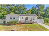 Charming white house with a deck and well-manicured lawn at 1412 Hemingway St., Myrtle Beach, SC 29577