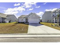 Charming one-story home with attached garage and well-manicured lawn at 3119 Hannon Dr., Myrtle Beach, SC 29579