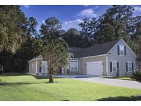Charming single-Gathering home with a well-manicured lawn and attached two-car garage at 323 Trestle Way, Conway, SC 29526