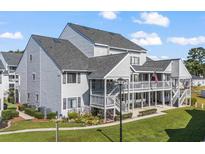 Attractive two-story condo building with well-manicured landscaping at 1880 Auburn Ln. # 24B, Surfside Beach, SC 29575