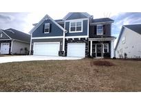 Charming two-story home with stone accents and a two-car garage at 173 Azure Loop, Myrtle Beach, SC 29588