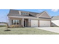 New construction home with two-car garage and landscaped lawn at 299 Hayloft Circle, Conway, SC 29526