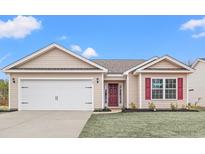 Newly constructed house with a two-car garage and a manicured lawn at 902 Owls Nest Dr., Conway, SC 29527