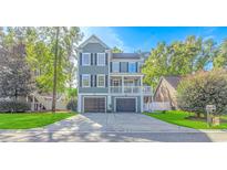 Charming two-story home with a two-car garage and a welcoming front porch at 136 Kenzgar Dr., Myrtle Beach, SC 29588
