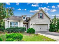 House exterior featuring a two-car garage and well-manicured lawn at 1660 Fairforest Ct., Conway, SC 29526