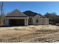 Newly constructed house with a two-car garage and neutral siding at 3174 Wayside Rd., Conway, SC 29527