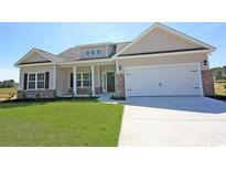 One-story house with beige siding, brick accents, and a two-car garage at 3340 Little Bay Dr., Conway, SC 29526