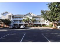 Two-story condo building with ample parking and lush landscaping at 5825 Catalina Dr. # 433, North Myrtle Beach, SC 29582