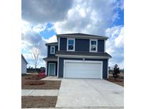 Charming two-story home featuring a pristine white garage door and a neatly maintained front yard at 8648 Farrier Dr., Myrtle Beach, SC 29588