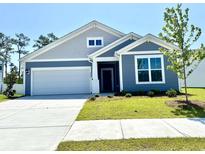 Charming single-Gathering home featuring a two-car garage and a well-maintained front lawn at 8663 Farrier Dr., Myrtle Beach, SC 29588