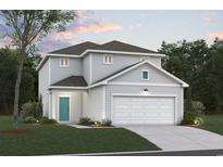 Two-story home featuring a two-car garage, light gray siding, a well-manicured lawn, and an inviting front door at Tbb Farrier Dr., Myrtle Beach, SC 29588