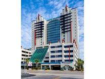 The Grand Atlantic resort featuring architectural details, covered parking, and nearby shopping and restaurants at 2007 S Ocean Blvd. # 401, Myrtle Beach, SC 29577