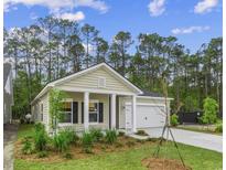 Charming single-Gathering home featuring a craftsman-style facade, landscaped yard, and attached garage at 9727 Indigo Creek Blvd., Murrells Inlet, SC 29576