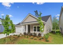 Charming single-story home with a one-car garage and beautifully landscaped front yard at 9742 Indigo Creek Blvd., Murrells Inlet, SC 29576