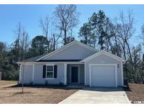 Charming one-story home with light gray siding, black shutters, and a well-manicured lawn at 1142 Cherrystone Loop, Conway, SC 29526