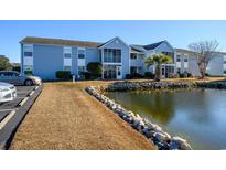 Exterior view of condo building with water view at 2257 Essex Dr. # E, Surfside Beach, SC 29575