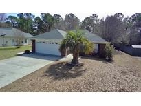 Charming one-story home with a two-car garage, mature trees, and inviting landscaping at 2783 Canvasback Trail, Myrtle Beach, SC 29588