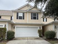 Charming two-story home with a two-car garage and well-maintained landscaping at 1060 Fairway Ln. # 1060, Conway, SC 29526