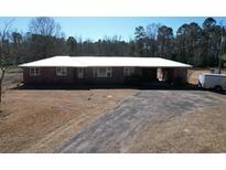 Ranch style home with a large yard and a long driveway at 4575 Saints Delight Rd., Georgetown, SC 29440