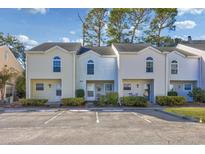 Three-unit townhouse building with parking and landscaping at 6703 Jefferson Pl. # B2, Myrtle Beach, SC 29572