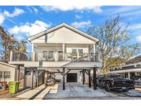 Two-story home with elevated deck and carport; modern design at 6001 - 1778 S Kings Hwy., Myrtle Beach, SC 29575