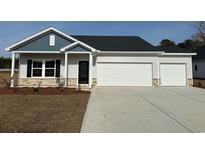 Charming home with a two-car garage, stone accents, and a well-maintained lawn at 114 Arrow Wood Dr, Conway, SC 29526