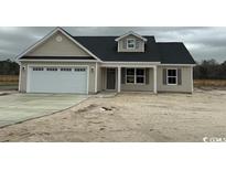 Charming single-Gathering home featuring a two-car garage and neutral siding at 2686 Hugo Rd., Conway, SC 29527