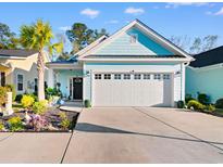 Charming light blue house with white garage door and landscaping at 1604 Carsens Ferry Dr., Conway, SC 29526