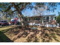 Charming single-story home with a large front yard, cozy porch, and mature tree with swing at 538 Calhoun Dr., Murrells Inlet, SC 29576