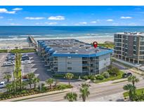 Beautiful condo building on the beach with ample parking and well maintained landscaping and ocean views at 6000 N Ocean Blvd. # 214, North Myrtle Beach, SC 29582