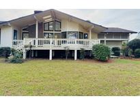 Expansive backyard view featuring a large deck, perfect for outdoor entertaining and relaxation at 3774 Annandale Dr., Myrtle Beach, SC 29577