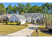Charming one-story home with landscaped yard, large driveway, and attached two-car garage at 5012 Lindrick Ct., Myrtle Beach, SC 29579