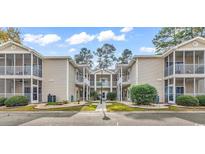 Attractive exterior of a two-story building with balconies and landscaping at 5310 Sweetwater Blvd. # 5310, Murrells Inlet, SC 29576