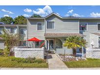 Charming two-story townhome with a cozy front patio and well-maintained landscaping, offering a welcoming curb appeal at 86 Shadow Moss Pl. # 86, North Myrtle Beach, SC 29582
