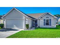 Attractive single-story home with a two-car garage and well-manicured lawn at 160 Somerworth Circle, Surfside Beach, SC 29575