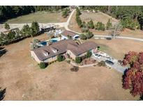 Aerial view of a single-Gathering home with pool, RV, boat, and expansive grounds at 1692 S Morgan Ave., Andrews, SC 29510