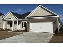 Charming single-story home featuring a two-car garage and neutral-colored siding and brick accents at 1009 Jase Dr., Longs, SC 29568