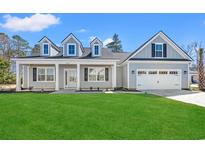 Charming single-Gathering home with a manicured lawn and a two-car garage at 1101 Anne St., North Myrtle Beach, SC 29582